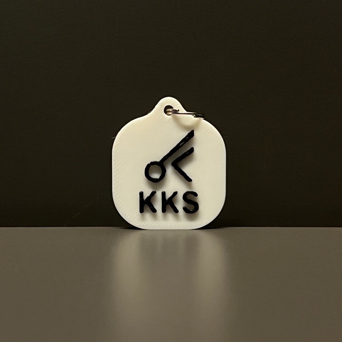 White KKS keychain
